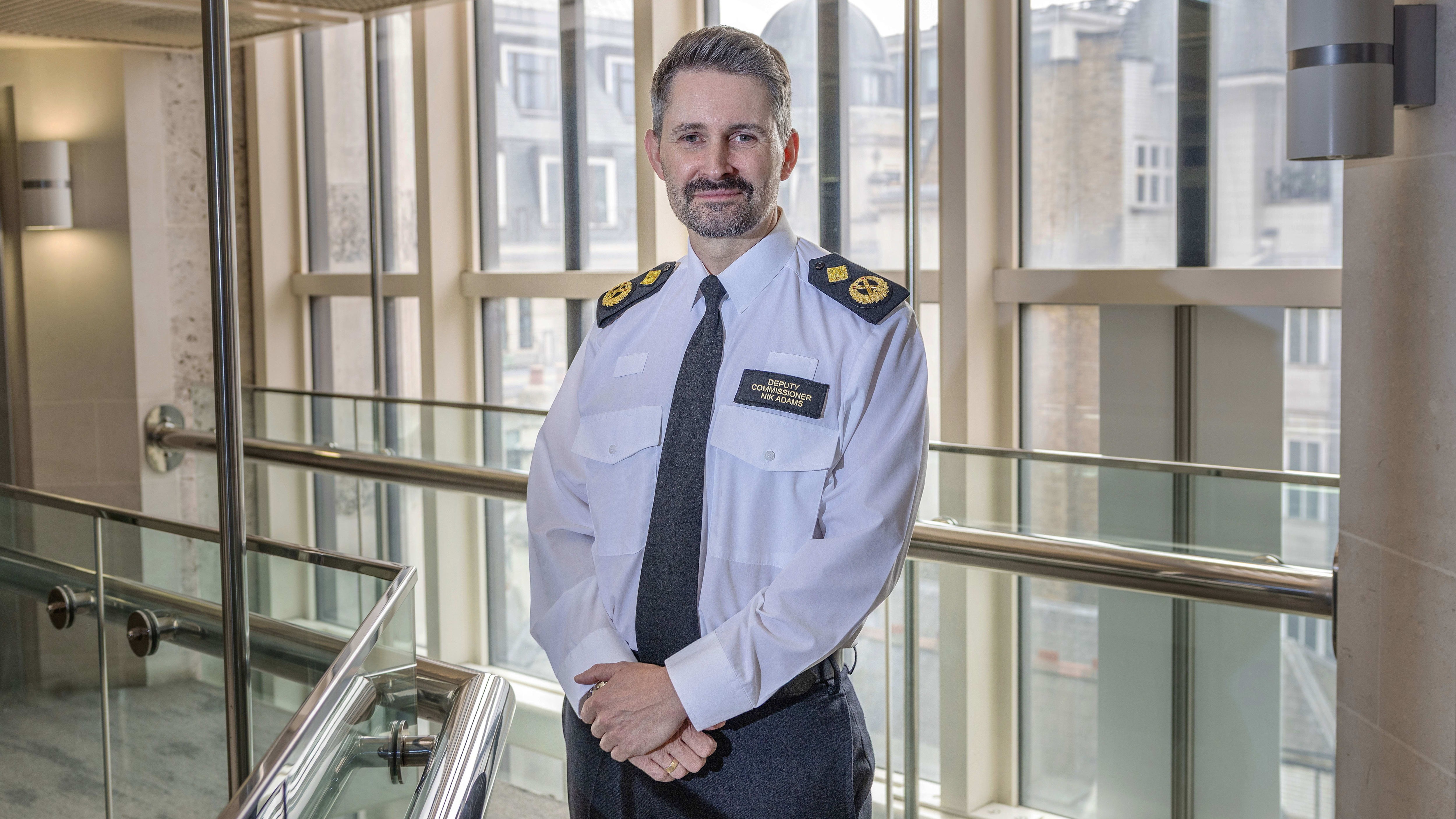 Deputy Commissioner Nik Adams stands in uniform inside the City of London Police headquarters at Guildhall.